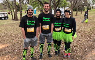 Bryan Hines, Curt Knobloch, Alisha Bowers, and Meagan Swenson showing frontside of Thor AMNAT shirts.