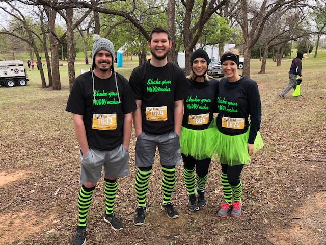 Bryan Hines, Curt Knobloch, Alisha Bowers, and Meagan Swenson showing frontside of Thor AMNAT shirts.