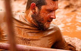 Curt Knobloch getting out of a mud pit.